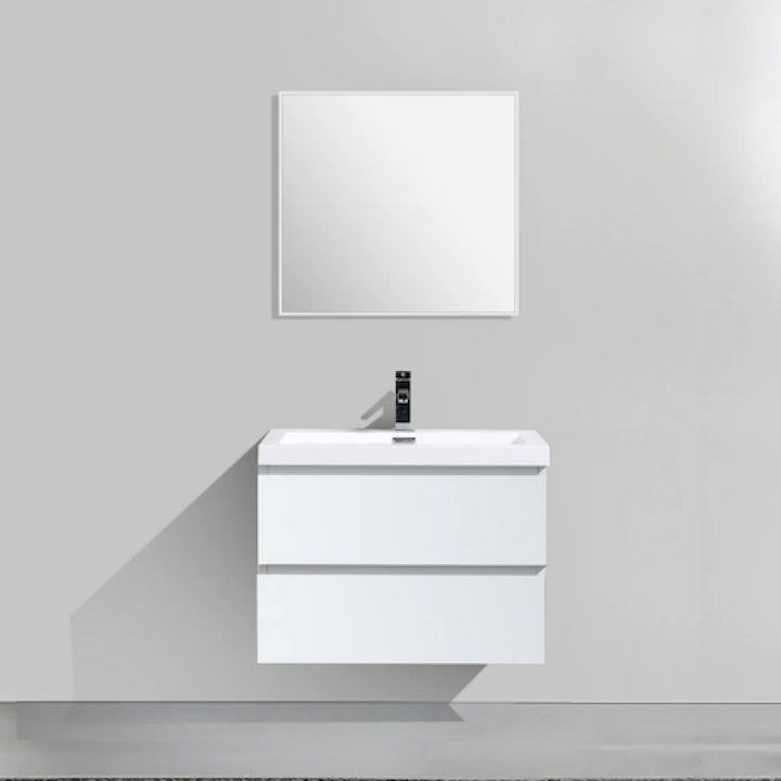 Aménagement moderne d'une salle de bain avec une vanité suspendue ARCTIC blanc mat et douche vitrée en arrière-plan.