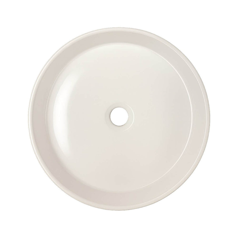 Petit lavabo rond en porcelaine blanche à poser – idéal pour une petite salle de bain moderne ou minimaliste.