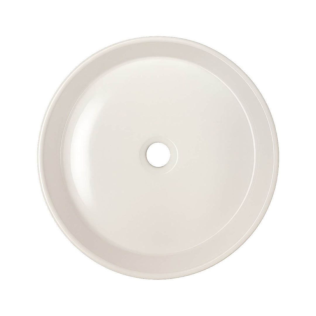 Petit lavabo rond en porcelaine blanche à poser – idéal pour une petite salle de bain moderne ou minimaliste.