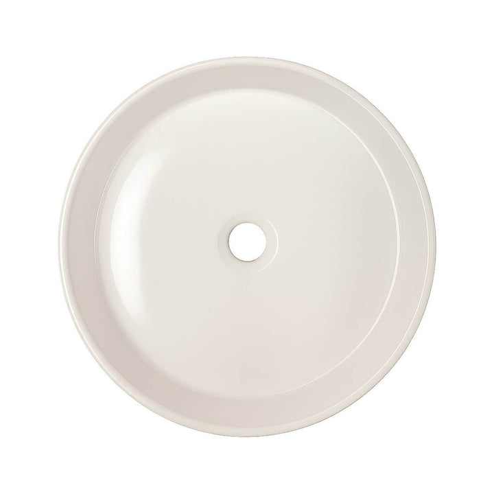 Petit lavabo rond en porcelaine blanche à poser – idéal pour une petite salle de bain moderne ou minimaliste.