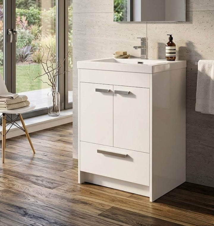 Vanité de salle de bain contemporaine de 24 pouces sur pieds, fini blanc brillant de haute qualité. Parfait pour optimiser l'espace. En inventaire à Montréal et dans la région de Laval